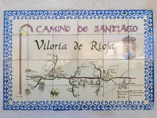 Tiled sign with a map of the Camino as it goes through.