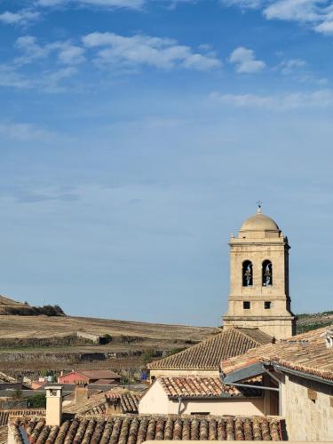 Church bell tower above the town of Hontanas