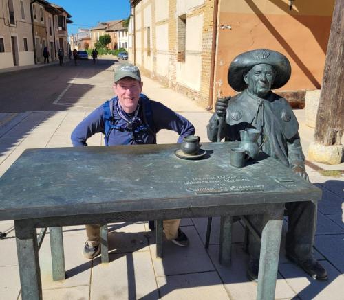 Dale sitting with the pilgrim for a typical meal.