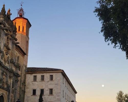 Monastery San Zoilo with full moon setting