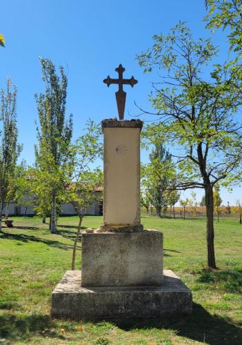 Cross of St. James and Camino shell as we enter Bercianos.