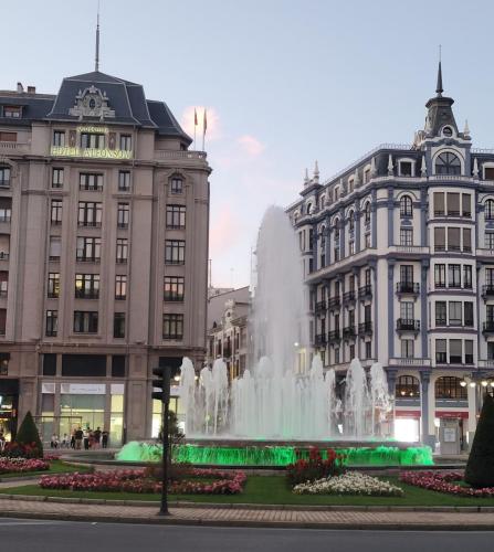 Lighted fountain in the center of a traffic circle