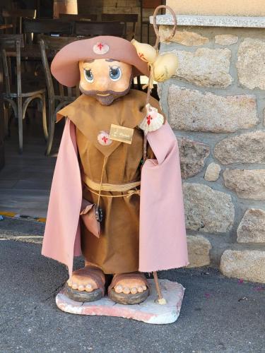 Cute pilgrim statue outside a cafe