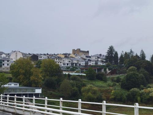 Looking up at Portomarin from the bridge.