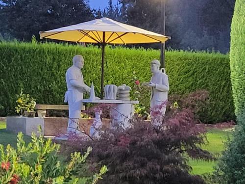 Statues in a park...pilgrims sharing a meal.