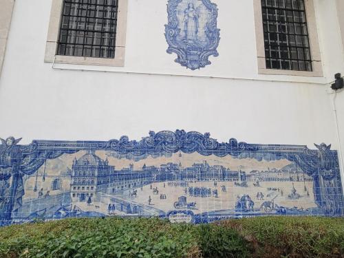 Scenic tiles on the side of a church