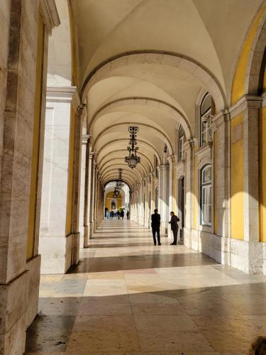 Looking down a colonnade in the Praca do Comercio